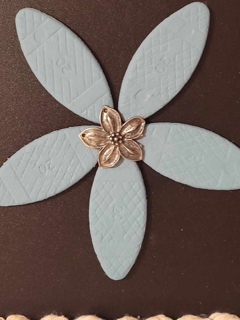 wooden blue flower in frame
