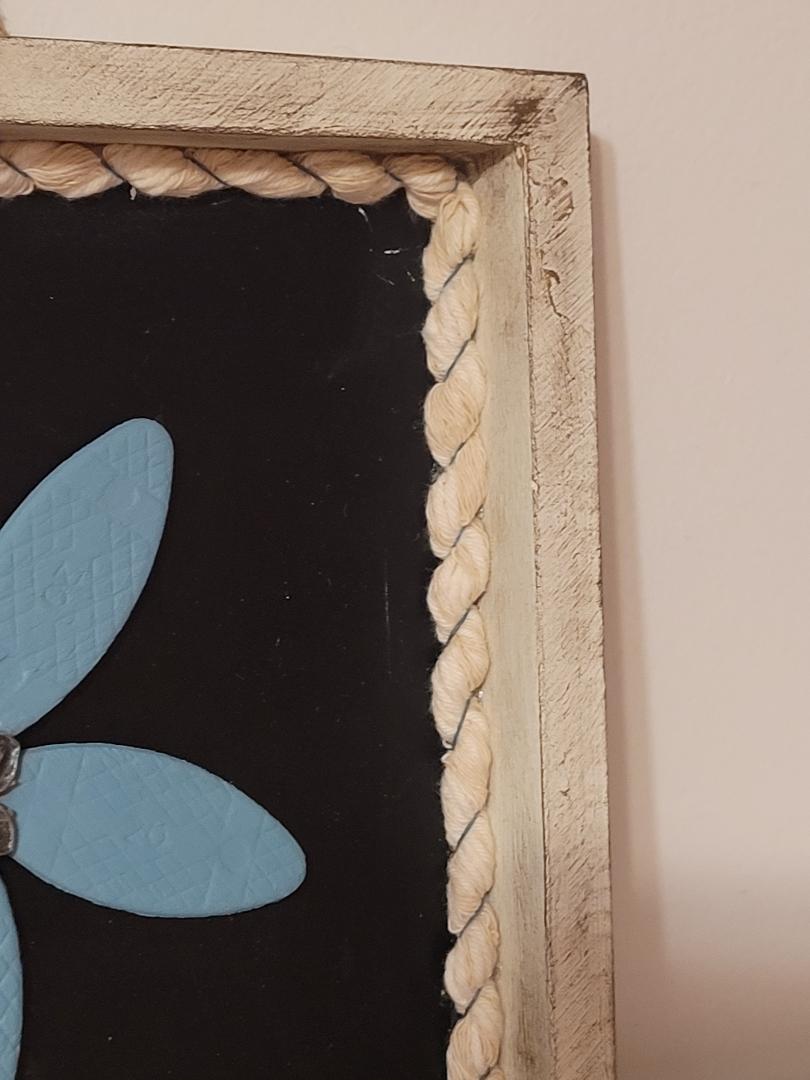 wooden blue flower in frame